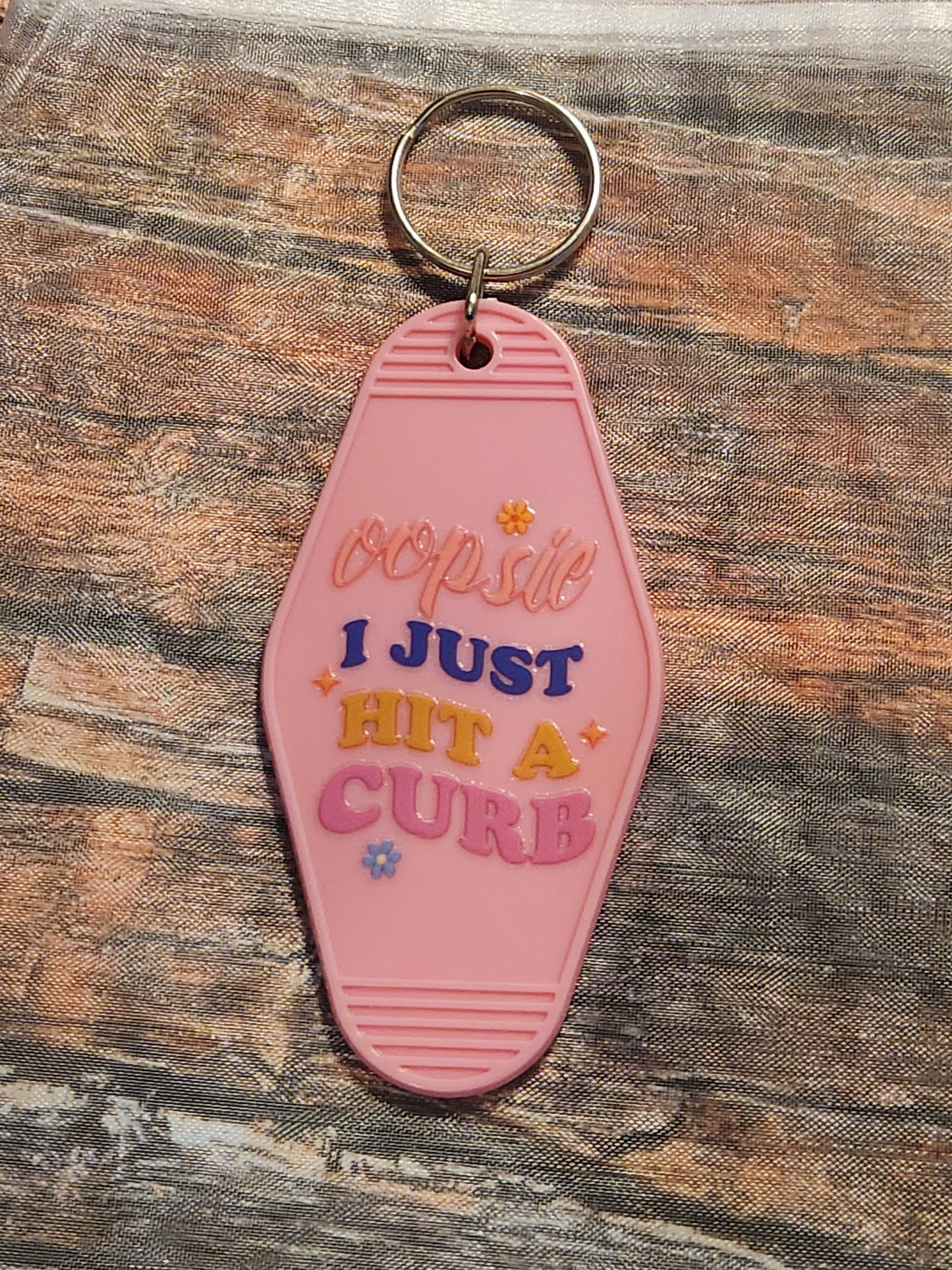 Motel Keychain: Oopsie, I just hit a curb (#2)