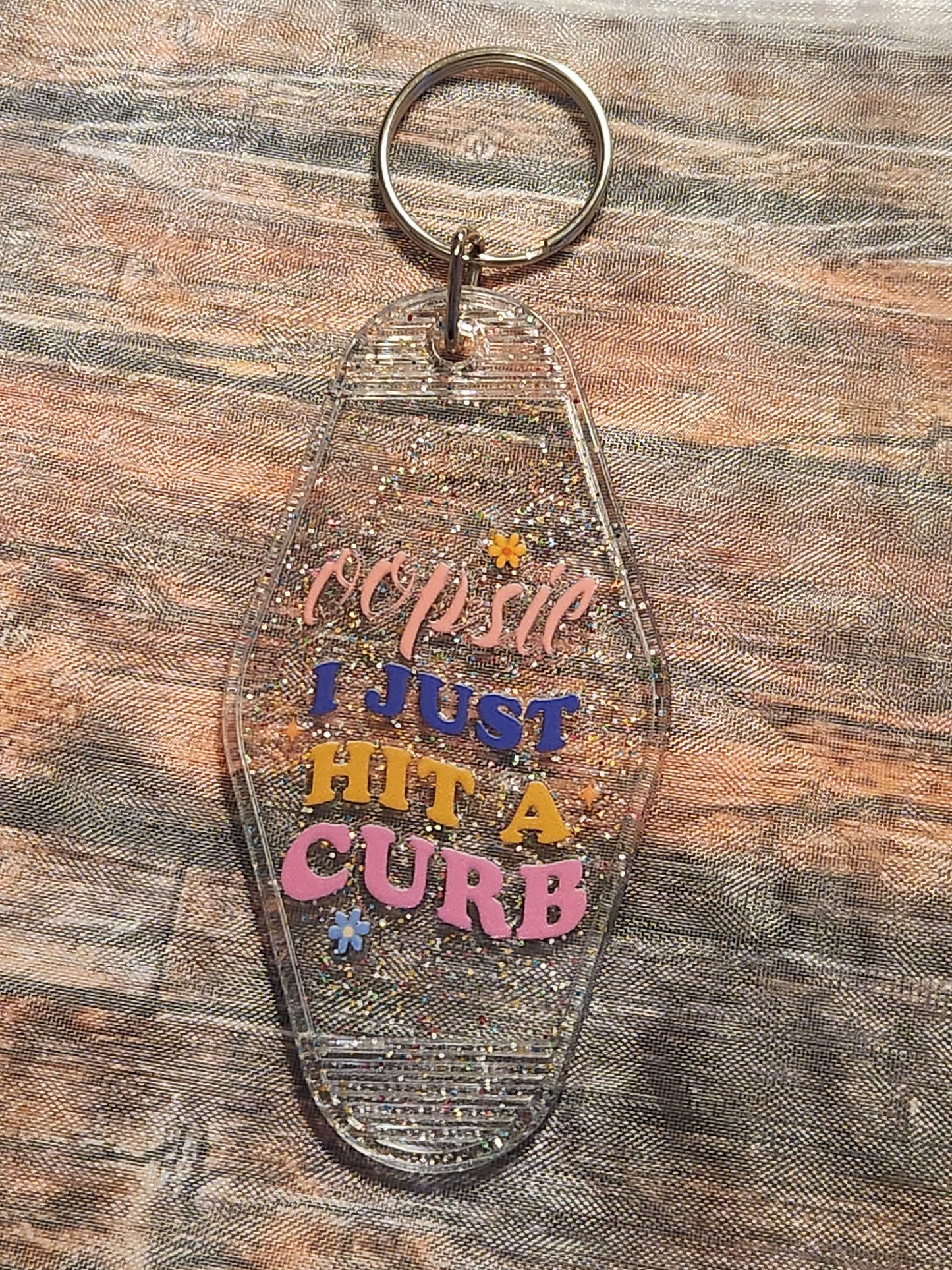 Motel Keychain: Oopsie, I just hit a curb