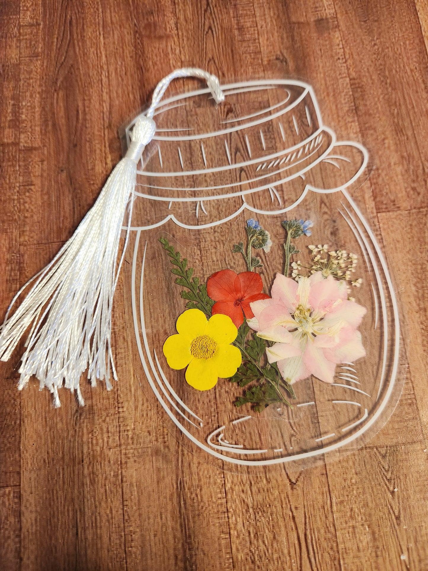 Bookmark: Shades of red, pink, yellow, and purple (white tassel)